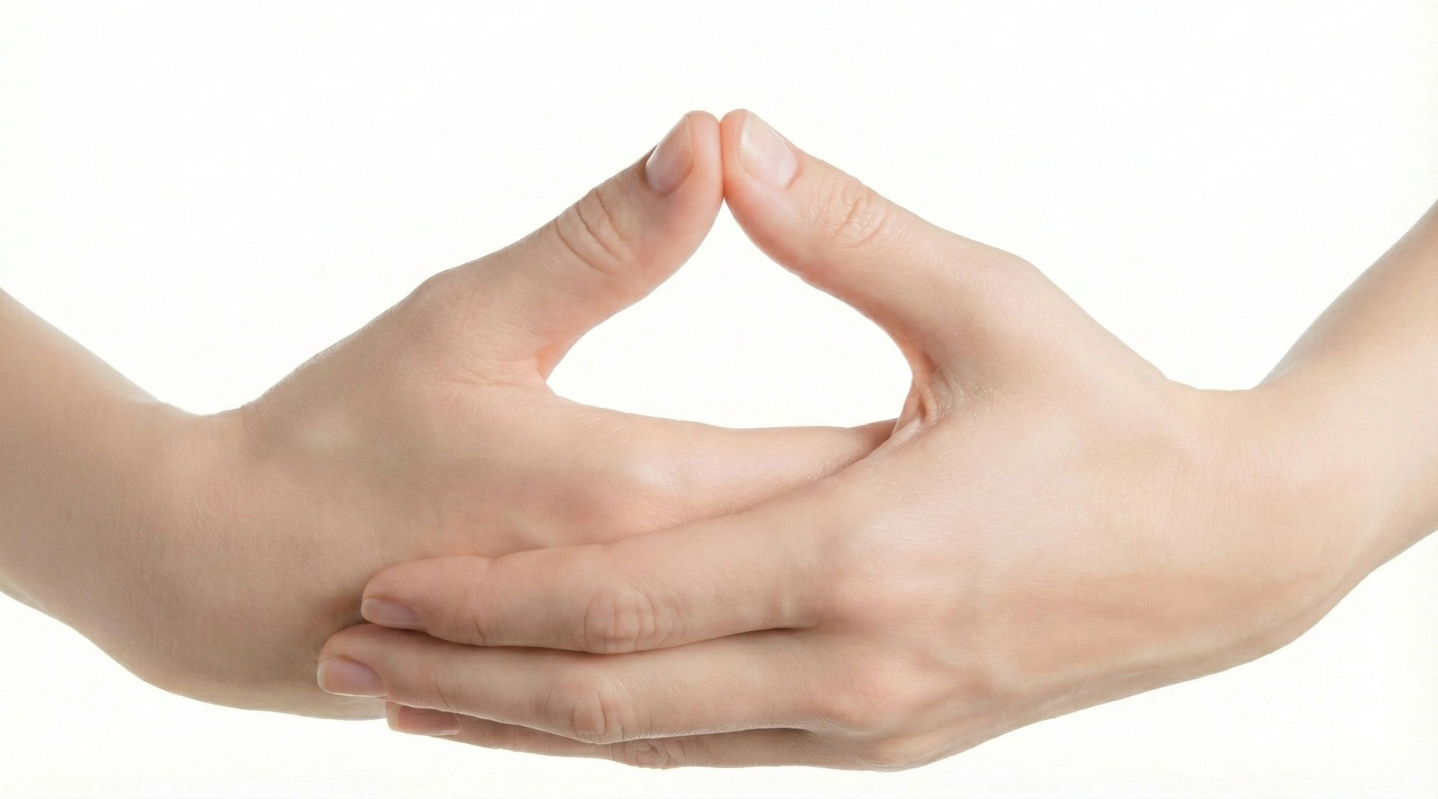 Hands resting in Dhyana Mudra, the classic gesture of meditation.